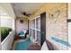 Cozy front porch with wicker furniture, a ceiling fan, and decorative accents at 161 Dairy Farm Rd, Mooresville, NC 28115