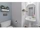 Powder room features pedestal sink, wainscoting and decorative accents at 161 Dairy Farm Rd, Mooresville, NC 28115