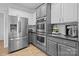 Kitchen features stainless steel appliances, granite countertops, and custom cabinets at 161 Dairy Farm Rd, Mooresville, NC 28115