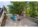 Relax on the outdoor patio with a stone fireplace and outdoor seating at 161 Dairy Farm Rd, Mooresville, NC 28115