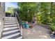 Relax on the outdoor patio with a stone fireplace and outdoor seating at 161 Dairy Farm Rd, Mooresville, NC 28115