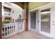 Private patio with white wooden fence, brick columns, and sliding glass doors at 17111 Doe Valley Ct, Cornelius, NC 28031