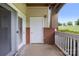 Relaxing outdoor patio with sliding glass doors and privacy wall with white door at 17111 Doe Valley Ct, Cornelius, NC 28031