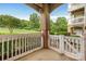 Covered patio featuring a white picket fence and views of the lawn at 17111 Doe Valley Ct, Cornelius, NC 28031