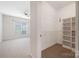 View from bedroom to walk-in closet with wire rack shelving and carpet at 17111 Doe Valley Ct, Cornelius, NC 28031