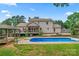 Inviting backyard boasts a sparkling pool, gazebo, and spacious deck for entertaining and relaxation at 1724 Windy Rush Ln, Gastonia, NC 28054