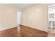 Neutral bedroom with wood flooring and an adjoining bathroom with a modern sink at 1724 Windy Rush Ln, Gastonia, NC 28054