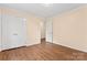 Cozy bedroom features hardwood floors, double closet, and neutral paint at 1724 Windy Rush Ln, Gastonia, NC 28054
