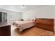Bright bedroom with a large window, wood floors, and ample space at 1724 Windy Rush Ln, Gastonia, NC 28054