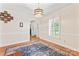 Elegant dining room with classic shutters, chandelier, and a stylish area rug at 1724 Windy Rush Ln, Gastonia, NC 28054