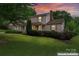 Charming two-story home with inviting curb appeal, mature trees, and well-maintained landscaping at 1724 Windy Rush Ln, Gastonia, NC 28054