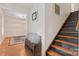 Inviting hallway featuring hardwood floors and staircase leading to upper levels at 1724 Windy Rush Ln, Gastonia, NC 28054