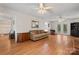 Spacious living room featuring hardwood floors and multiple seating areas with great lighting at 1724 Windy Rush Ln, Gastonia, NC 28054