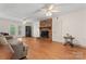 Cozy living room with a brick fireplace, hardwood floors, and access to an outdoor deck at 1724 Windy Rush Ln, Gastonia, NC 28054