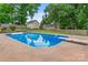 Sparkling in-ground pool surrounded by a concrete patio, ideal for summer fun at 1724 Windy Rush Ln, Gastonia, NC 28054