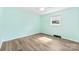 Light green bedroom features wood flooring, window, and neutral trim at 1822 N New Hope Rd, Gastonia, NC 28054