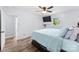 Stylish bedroom with wood-look floors, ceiling fan, and a comfy bed, offering a relaxing retreat at 1822 N New Hope Rd, Gastonia, NC 28054
