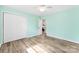 Bedroom with ample closet space, wood floors, and a light green painted walls at 1822 N New Hope Rd, Gastonia, NC 28054
