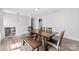 Dining room area with wood flooring and a wooden dining table set with bench and chairs at 1822 N New Hope Rd, Gastonia, NC 28054