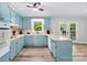 Kitchen with blue cabinets, updated appliances, and ample counter space, perfect for cooking at 1822 N New Hope Rd, Gastonia, NC 28054