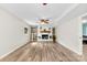 Bright living room featuring a charming fireplace with decor, wood floors, and freshly painted walls at 1822 N New Hope Rd, Gastonia, NC 28054