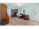 Office space with wood floors, desk, office chair, and built-in bookcase, offering ample storage at 1822 N New Hope Rd, Gastonia, NC 28054
