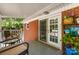 View of the outdoor porch showing the back of the brick house with easy access to backyard at 1822 N New Hope Rd, Gastonia, NC 28054