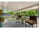 Relax on this cozy porch with outdoor seating overlooking the lush greenery at 1822 N New Hope Rd, Gastonia, NC 28054
