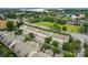 Aerial view of townhomes with a lake and green landscape in the background, providing a scenic and appealing community setting at 18460 W Catawba Ave, Cornelius, NC 28031