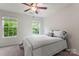 Bright bedroom with large windows and a comfortable bed, offering a peaceful and serene environment at 18460 W Catawba Ave, Cornelius, NC 28031