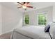 Well-lit bedroom with large windows and a cozy bed, perfect for a restful night's sleep and relaxation at 18460 W Catawba Ave, Cornelius, NC 28031