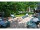 Backyard fire pit area with comfortable seating nestled amidst green foliage at 189 Mills Ln, Fort Mill, SC 29708