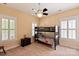 Bright bedroom with a bunkbed, ceiling fan, and natural light from the windows at 189 Mills Ln, Fort Mill, SC 29708