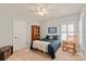 Bedroom with a bed, rocking chair, and a built-in bookcase and a ceiling fan at 189 Mills Ln, Fort Mill, SC 29708