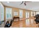 Bonus room featuring plantation shutters, desk, exercise equipment and hardwood flooring at 189 Mills Ln, Fort Mill, SC 29708