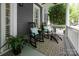 Inviting front porch features rocking chairs with plush cushions and a stylish patterned rug at 189 Mills Ln, Fort Mill, SC 29708