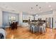 Well-lit kitchen with island seating, stainless steel appliances, flowing into the adjacent dining area at 189 Mills Ln, Fort Mill, SC 29708
