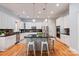 Bright kitchen features a large center island, granite countertops, stainless steel appliances, and hardwood flooring at 189 Mills Ln, Fort Mill, SC 29708