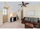 Bright living room featuring a ceiling fan and neutral walls with light-colored carpet at 189 Mills Ln, Fort Mill, SC 29708