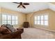 Comfortable living room with a sofa, ceiling fan, and natural light from the windows at 189 Mills Ln, Fort Mill, SC 29708