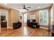 Inviting home office with wood floors, natural light from shuttered windows, and a ceiling fan at 189 Mills Ln, Fort Mill, SC 29708