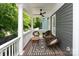 Covered front porch with neutral tones and decor, complete with seating at 189 Mills Ln, Fort Mill, SC 29708