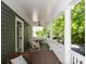 Comfortable covered porch featuring white columns, chairs, and neighborhood views at 189 Mills Ln, Fort Mill, SC 29708