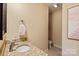 Well-lit powder room featuring granite countertops and contemporary sink fixtures at 189 Mills Ln, Fort Mill, SC 29708