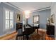 Elegant room with grand piano, natural light from shuttered windows, and stylish decor at 189 Mills Ln, Fort Mill, SC 29708