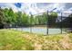 Community tennis court with net and tall fence at 189 Mills Ln, Fort Mill, SC 29708