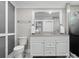 Bathroom featuring double sinks, a mirror, gray walls, and a toilet at 195 Bluebird Ln, Salisbury, NC 28146