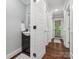 Hallway bathroom with dark wood vanity, vessel sink, and neutral walls and flooring at 195 Bluebird Ln, Salisbury, NC 28146