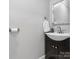 Close up view of a half bathroom with a dark wood vanity and vessel sink at 195 Bluebird Ln, Salisbury, NC 28146