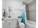 Bathroom with white vanity, mirror, and shower with a blue curtain at 195 Bluebird Ln, Salisbury, NC 28146